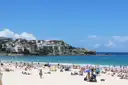 The north end of Bondi Beach with houses on the hill above the sand