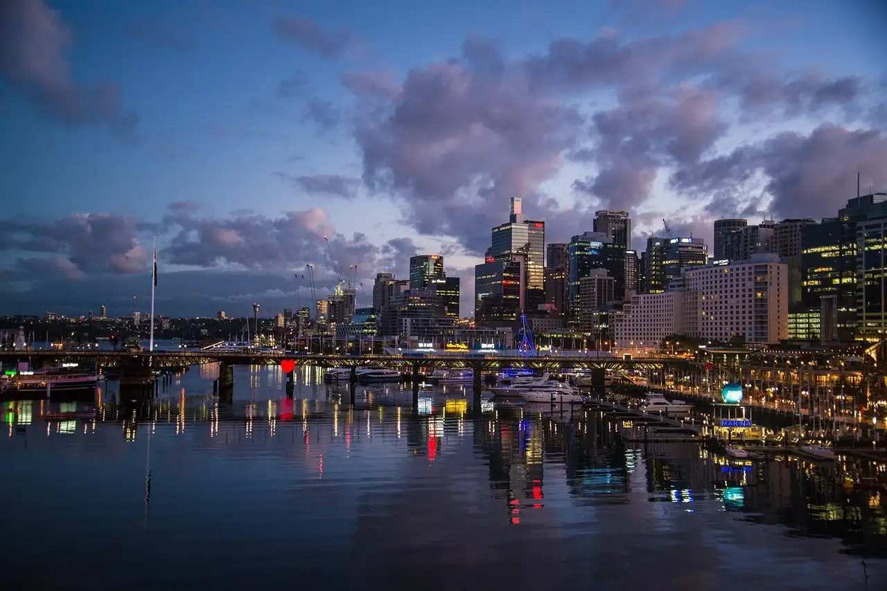 Darling Harbour at dusk with city lights reflected in the water