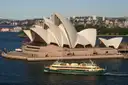 A ferry passing the Sydney Opera House on the harbour