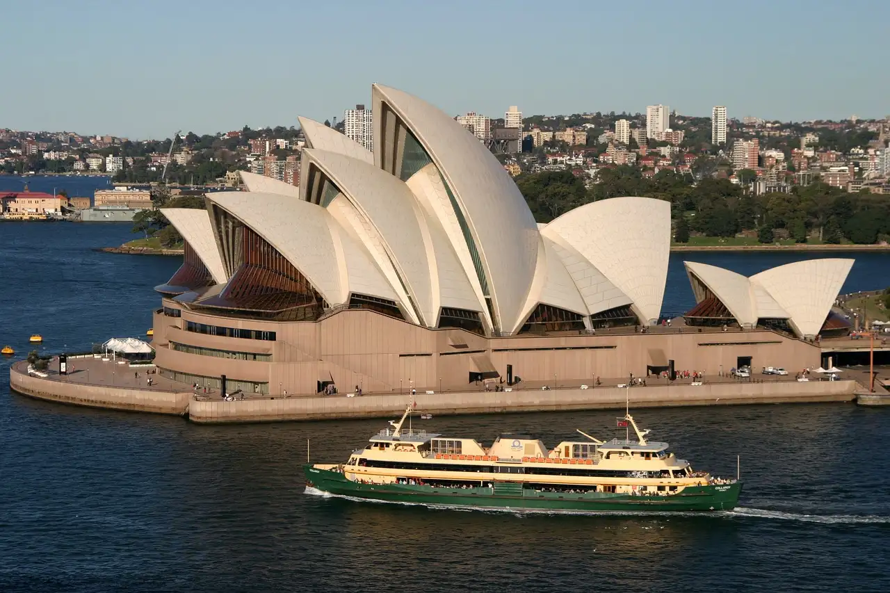 A ferry passing the Sydney Opera House on the harbour