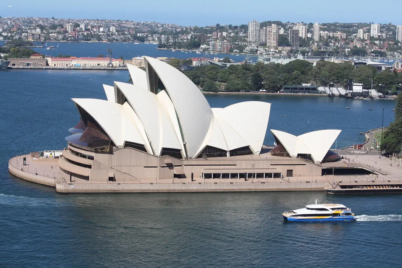 A ferry passing the Sydney Opera House on the harbour
