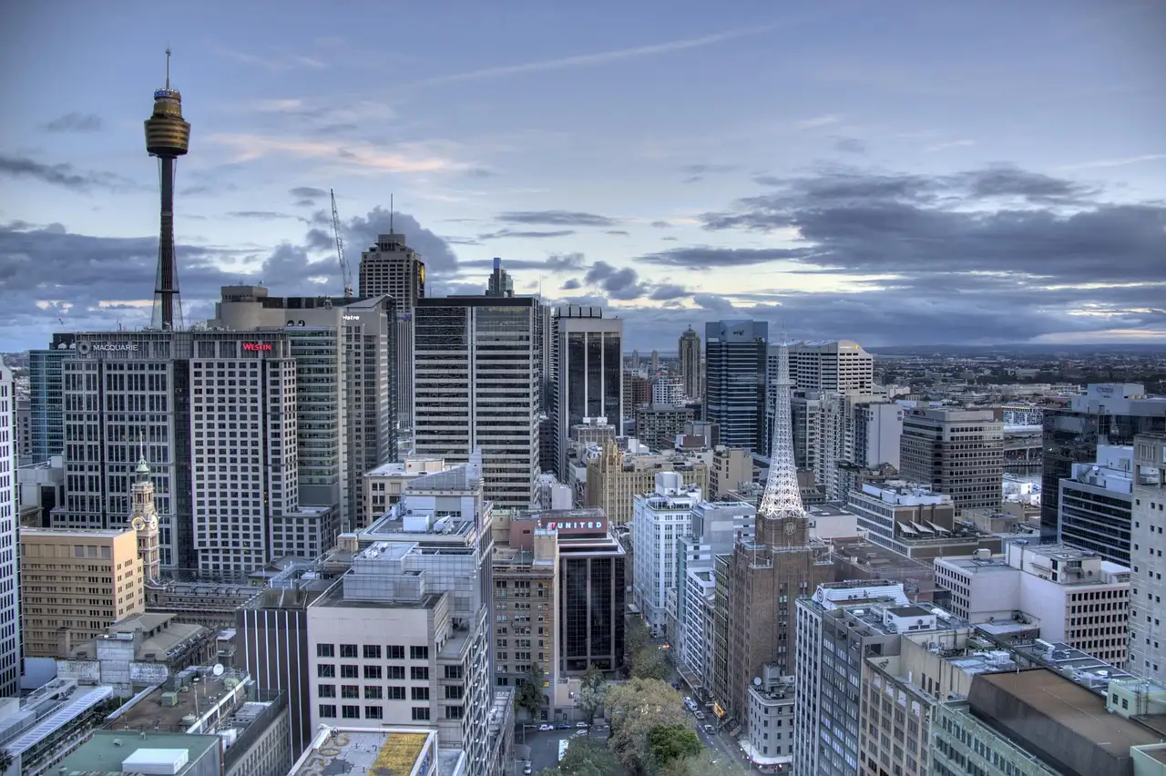Sydney city centre from above, office towers and older buildings with Sydney Tower rising over the CBD