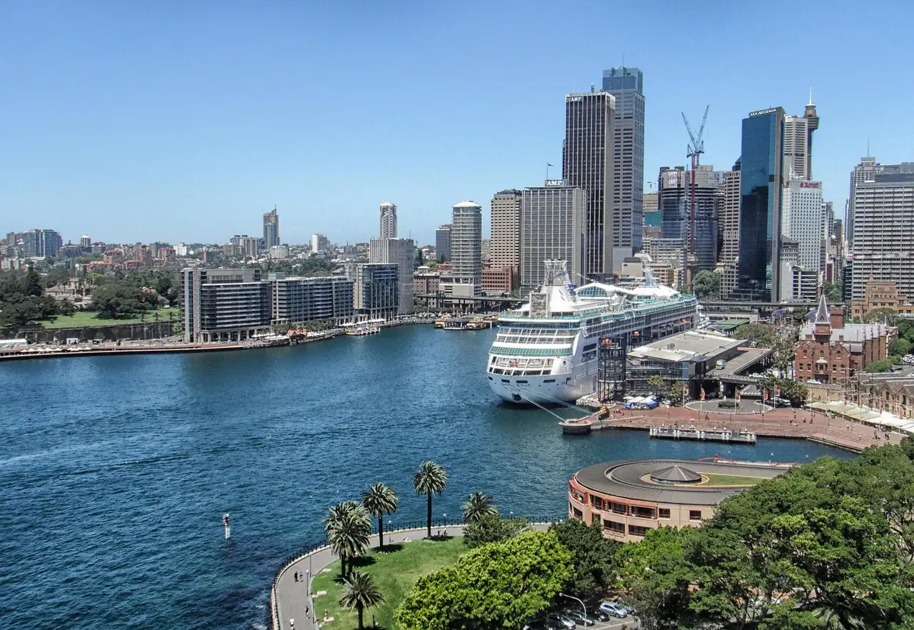 Circular Quay from above with a cruise ship at the terminal, The Rocks waterfront and the city towers behind