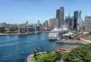 Circular Quay from above with a cruise ship at the terminal, The Rocks waterfront and the city towers behind